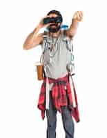 Free photo backpacker with binoculars over isolated white background