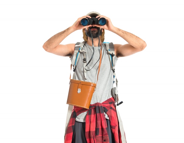 Free photo backpacker with binoculars over isolated white background