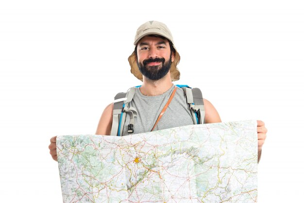 Backpacker with map over white background