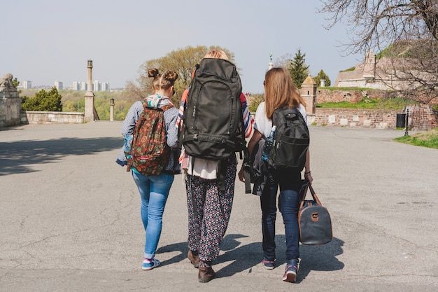 Backpackers walking in city