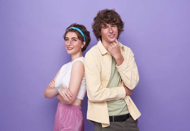 Backtoback photo of young happy smiling cheerful couple of friends with crossed hands