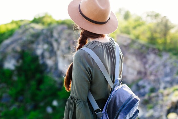 Backview of tourist in rocky landscape