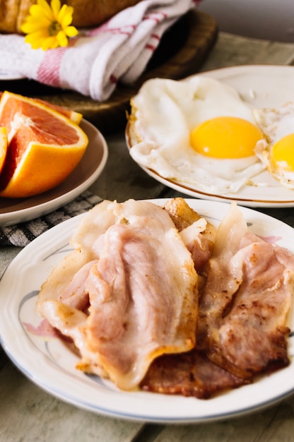 Bacon and eggs on table