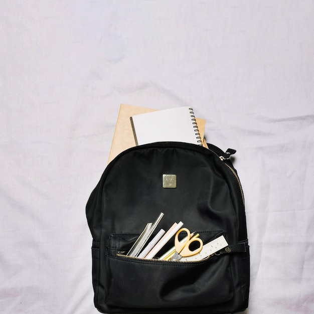 Bag with sketchbooks and office supplies