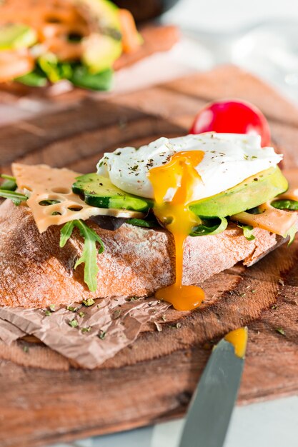 baguette and cheese on wooden table