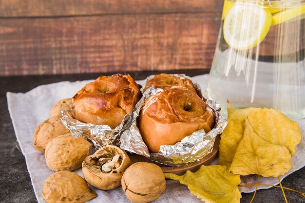 Baked apples in foil on plate