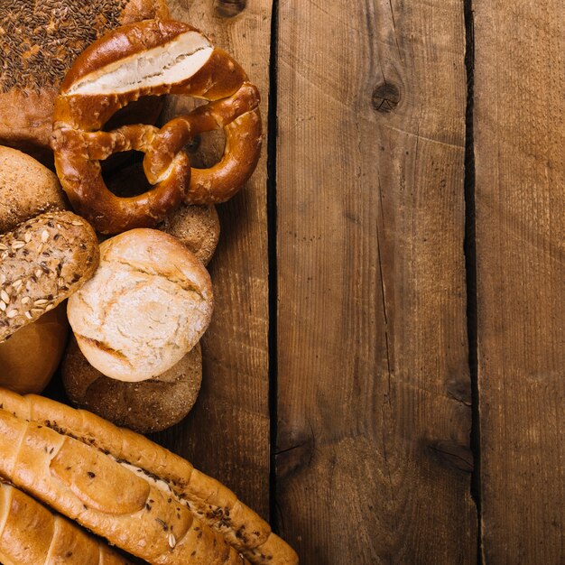 Baked breads on wooden table with space for text