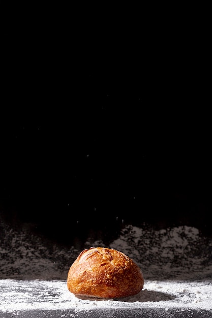 Baked bun with black copy space background