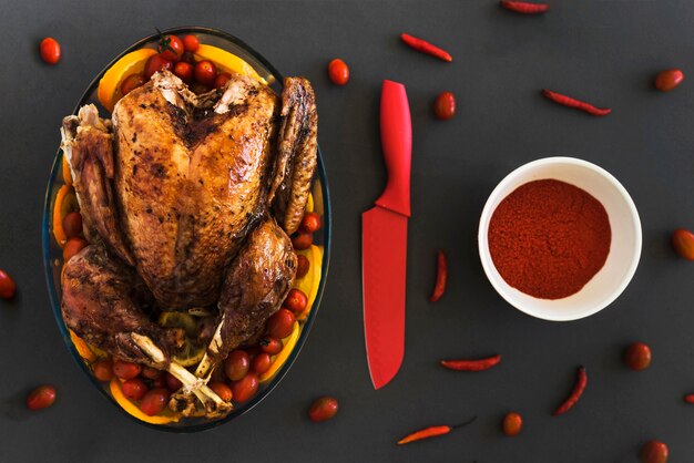 Baked chicken in glassware on grey table