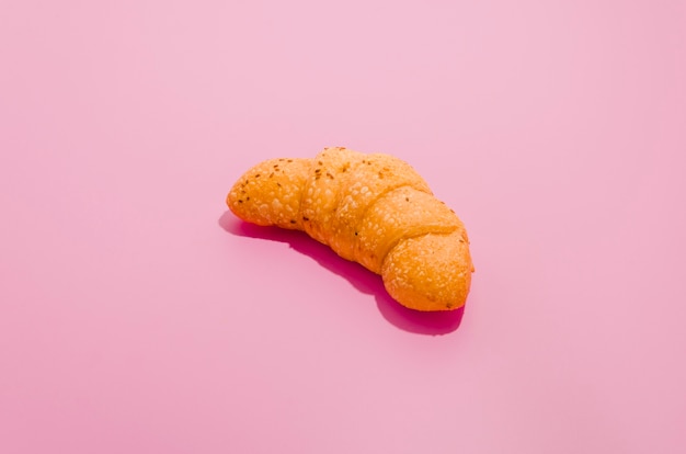 Baked croissant with color background