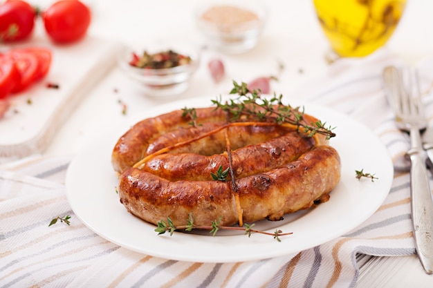 Baked homemade sausage on a white plate. Thanksgiving Day.