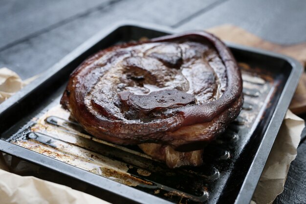 Baked meat on baking sheet