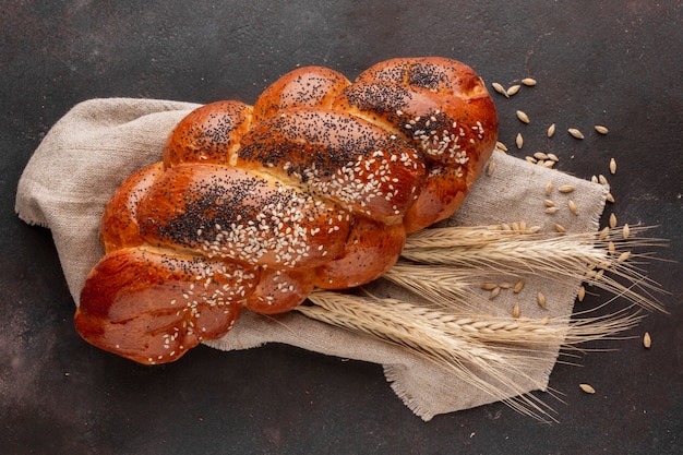 Baked pastry on cloth with wheat