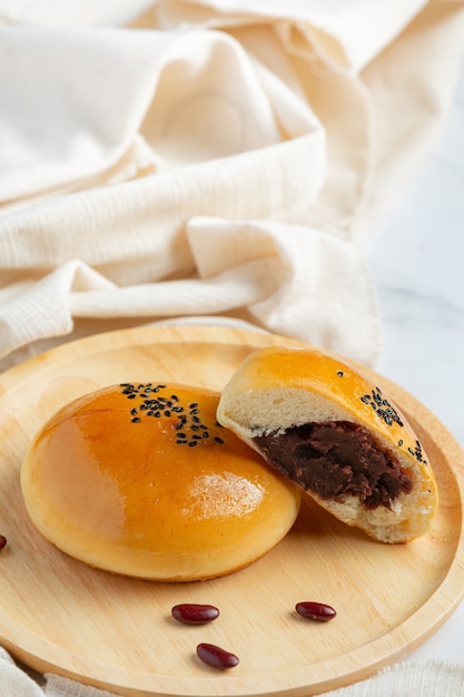 baked red bean paste buns on wooden plate