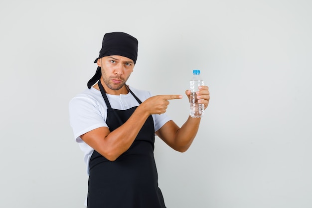 Baker man pointing at bottle of water in t-shirt