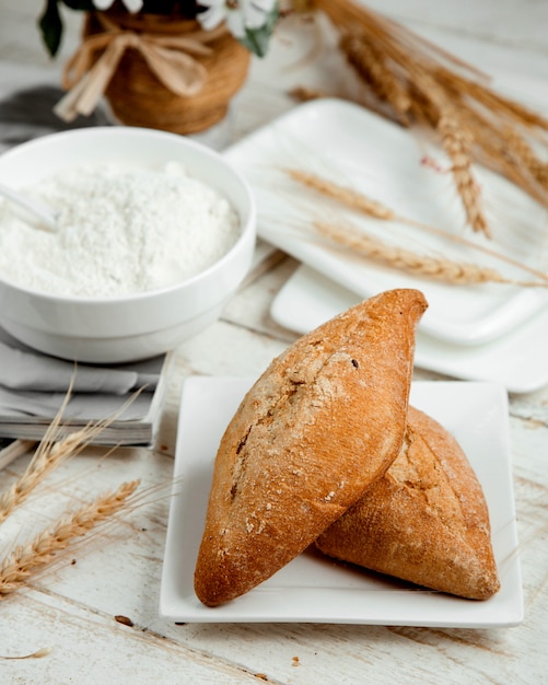 Bakery with sour cream and wheat branch on the table