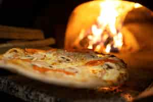 Free photo baking delicious pizza with wood fired oven