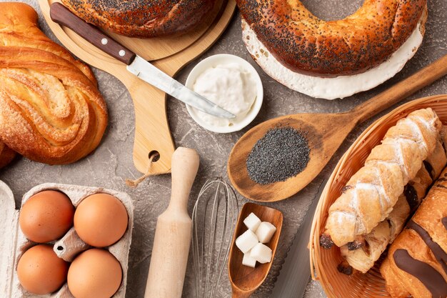 Baking and tasty bagels flat lay