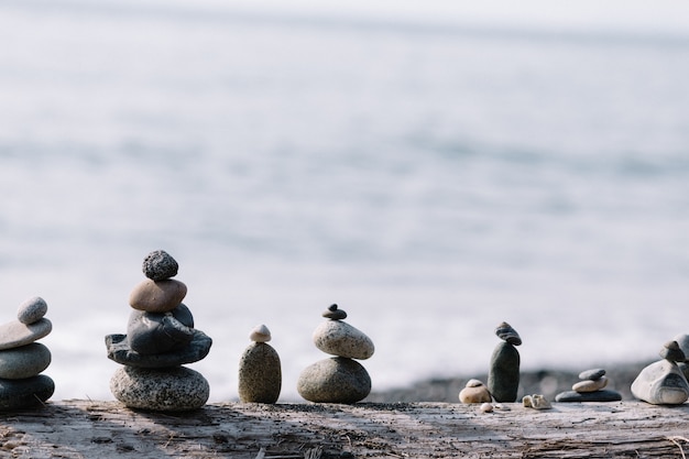 Balancing rocks on each other at the beach