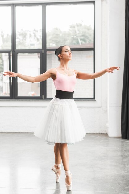 Ballerina dancer dancing on tip toe in dance floor