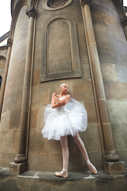 Ballerina performing near an old castle