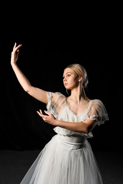 Ballerina posing while wearing tutu dress