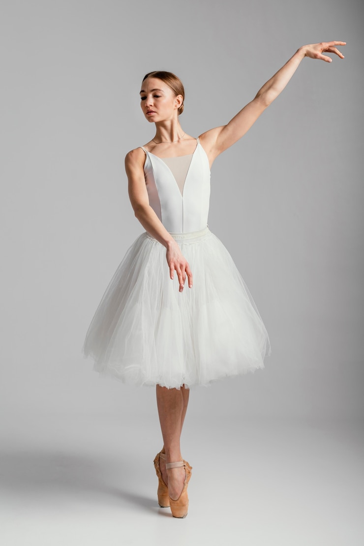Free Photo ballerina standing with pointe shoes