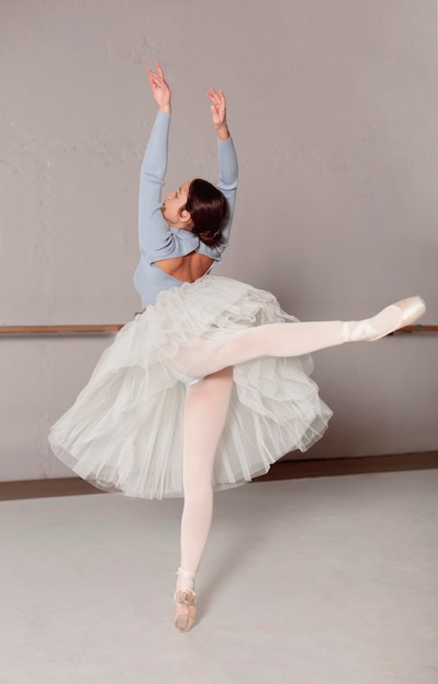 Ballerina in tutu skirt practicing ballet