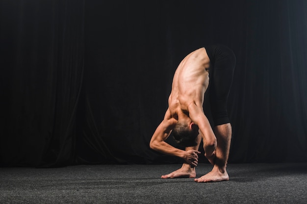 Ballerino stretching with copy space