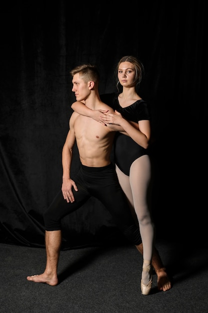 Ballet couple posing in tights and leotard