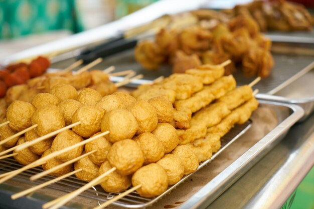 Balls set in row on a wooden stick