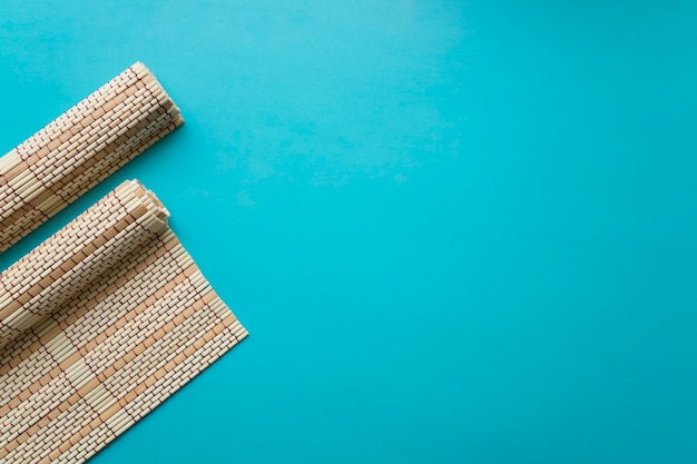 Bamboo clothes on blue background