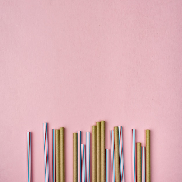 Free photo bamboo and plastic straws copy space