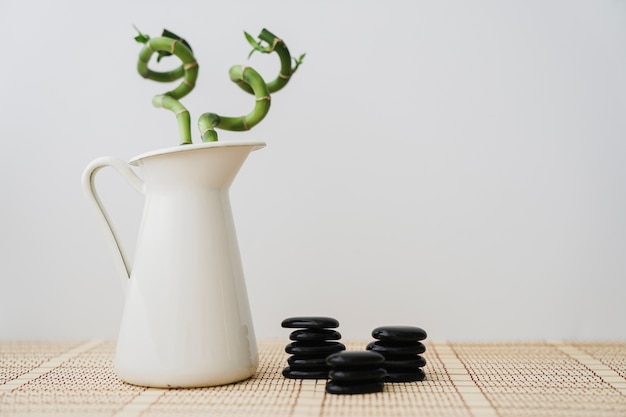 Free photo bamboo with three piles of volcanic stones