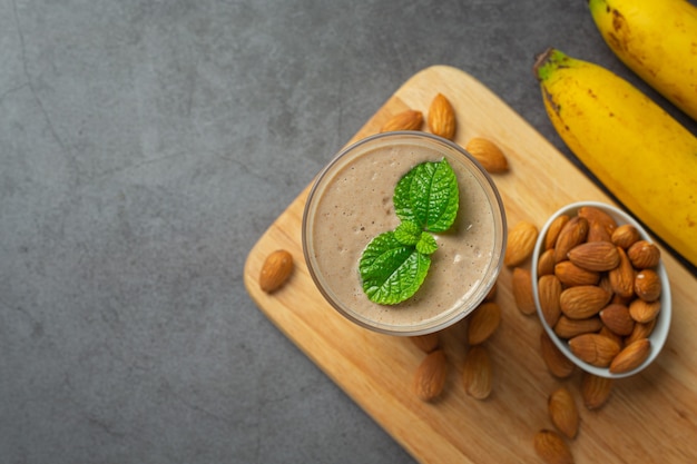 Banana almond smoothie on dark background