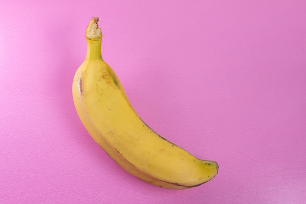 Free photo banana on the pink