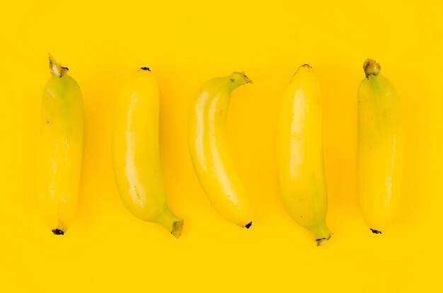 Bananas on colored background