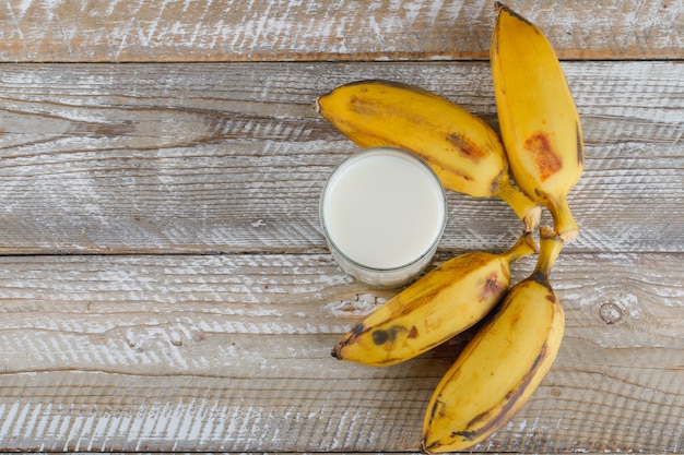 Bananas with milk on wooden,