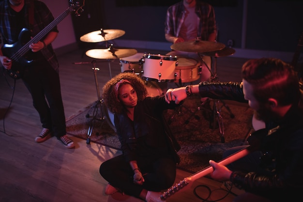 Band mates giving fist bump to each other