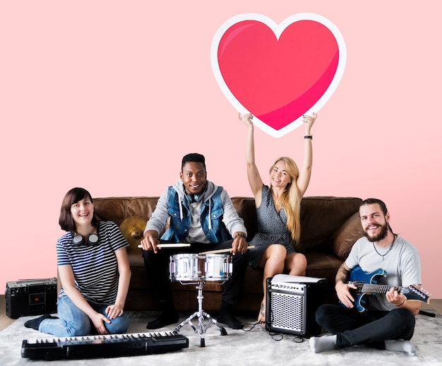 Band of musicians holding a heart emoticon