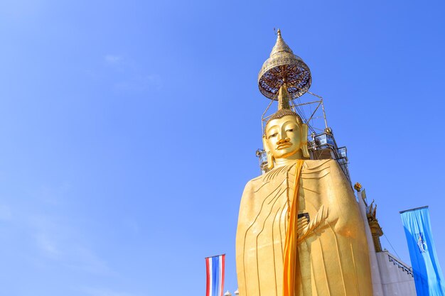 Bangkok Thailand December 17 2018 Standing golden Buddha statue at Wat Intharawihan one of the tallest in Thailand