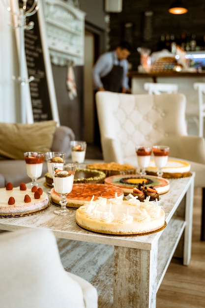 Bar still life with cakes on table