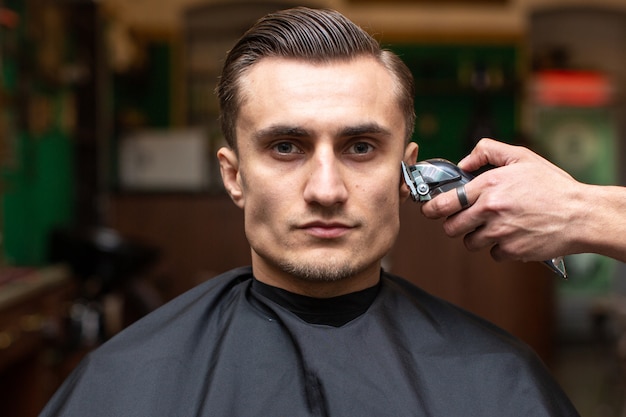 A barber makes haircut