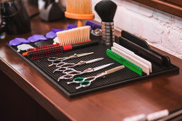 Free photo barber shop equipment on wooden table