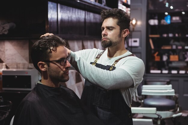 Barber styling clients hair