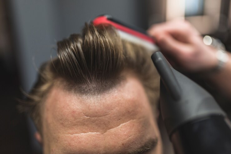 Free Photo barber styling hair of crop client