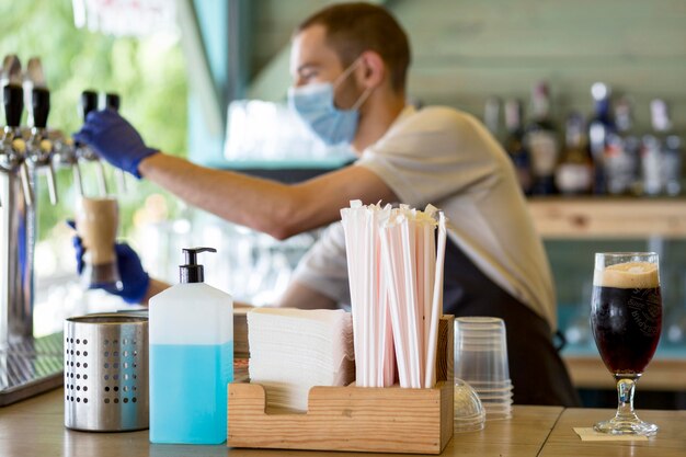 Barista male at work with mask