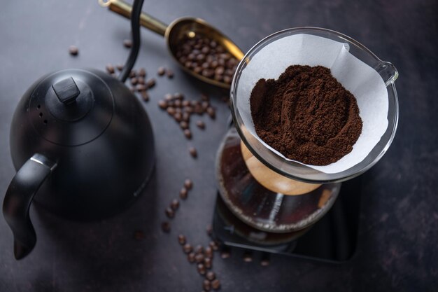 Barista pouring coffee with chemex