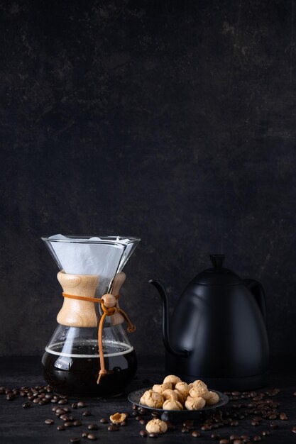 Barista pouring coffee with chemex