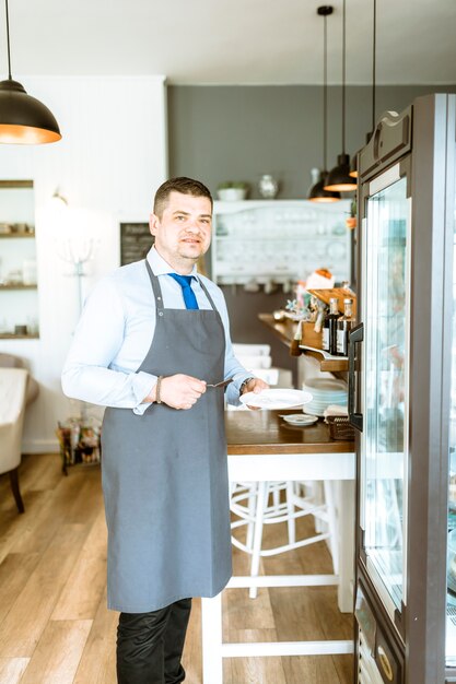 Barman holding plate